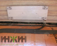 Монтаж радиатора отопления на стене из бревна