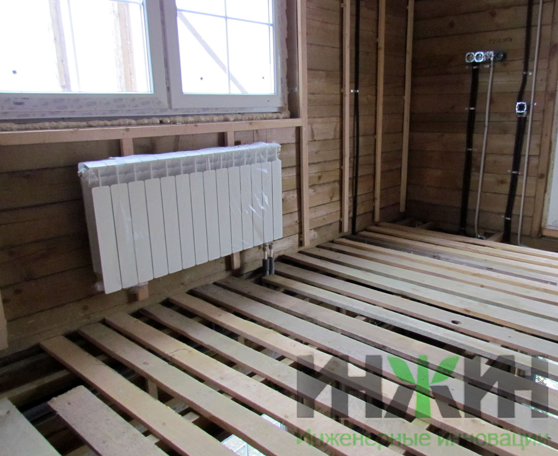 Отопление деревянного дома, установка радиатора Rifar